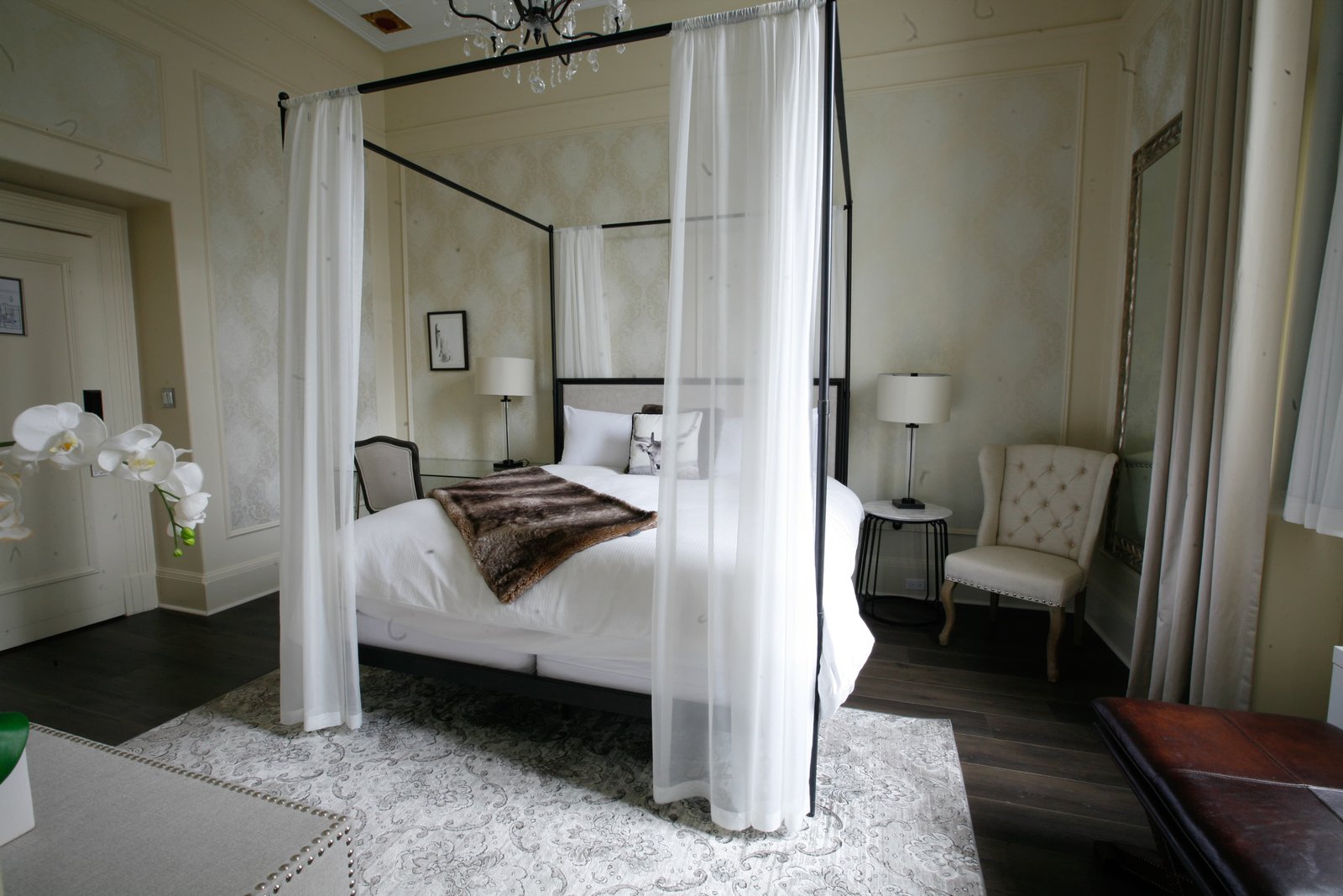 Fort Garry Hotel canopy bed with white draping interior design